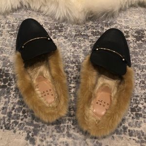 Black backless leather mules with faux fur